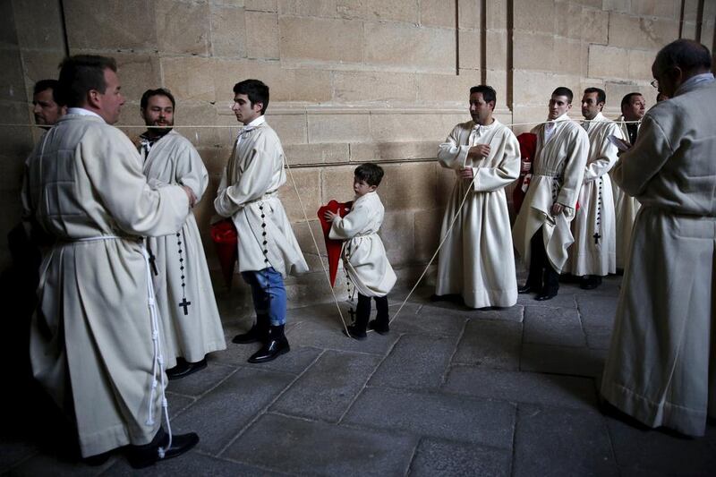 Penitents of the “Cristo de las Injurias” brotherhood wait inside a church before they take part in the “Procesion del Silencio” (Silence Procession) during Holy Week in Zamora, Spain. Juan Medina / Reuters