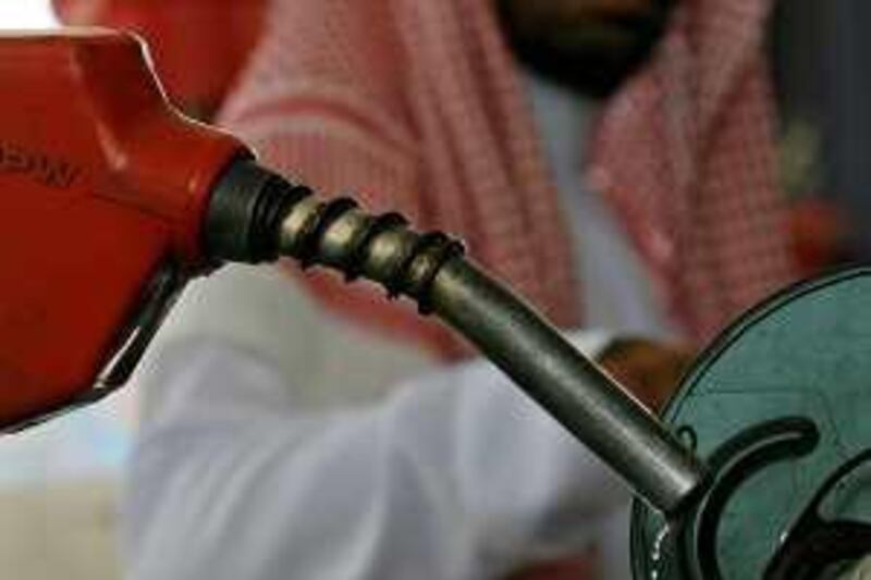 A Saudi looks at oil driping from a petrol pump after filling the tank of his car at a station in Jeddah on June 21, 2008. The world's top oil producers and consumers convene in the Red Sea city of Jeddah tomorrow to grapple with record high oil prices, with some OPEC members balking at consumer demands for more crude. AFP PHOTO/HASSAN AMMAR