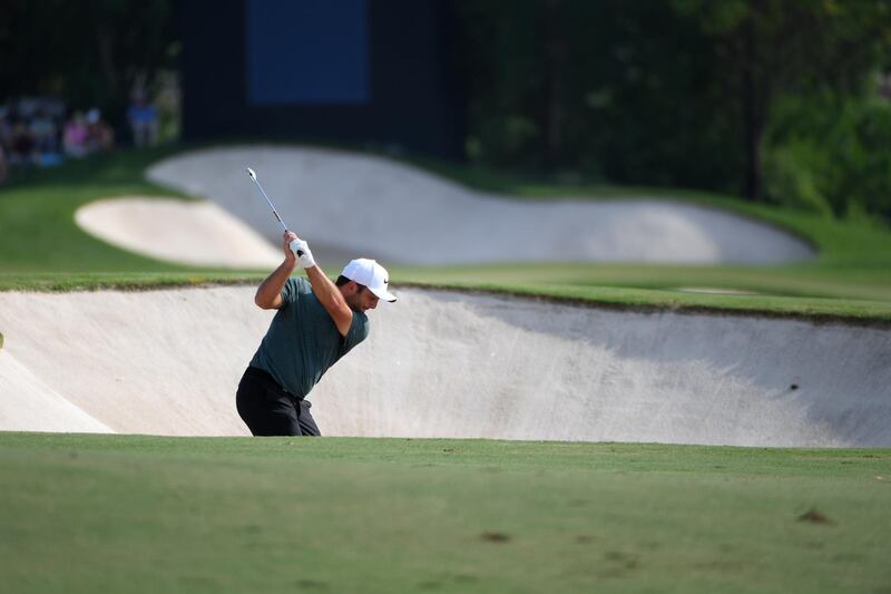 Francesco Molinari  hits his second shot on the 16th hole during the second round of the DP World Tour Championship. Ross Kinnaird / Getty Images