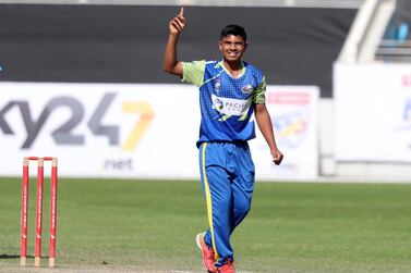 Fujairah's Aayan Afzal Khan after taking the wicket of Dubai's Ronak Panoly in the Emirates D20. Chris Whiteoak / The National
