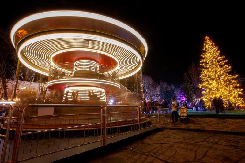 A picture made with a slow shutter speed shows a carousel being installed in downtown during Christmas preparations in Chisinau, Moldova. Dumitru Doru / EPA