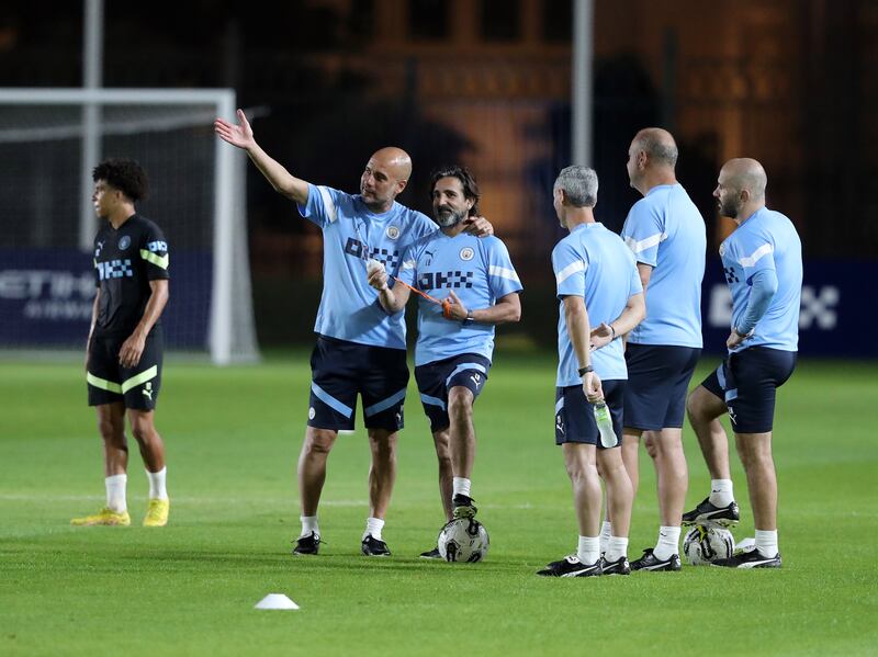 Manchester City manager Pep Guardiola with his coaching staff. 