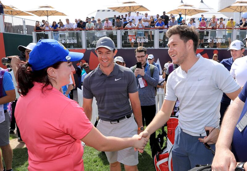 Niall Horan meets Saoirse Lambe of Ireland as Rory McIlroy of Northern Ireland looks on.  David Cannon / Getty Images