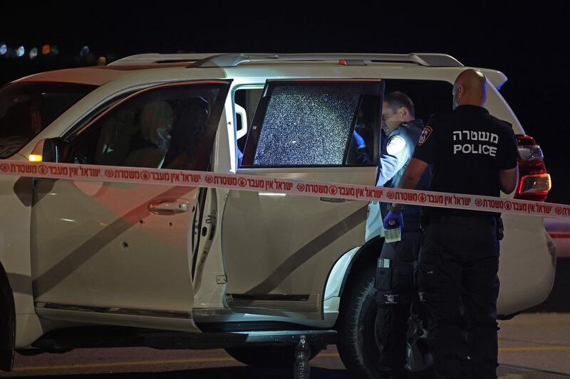 Israeli security forces examine a vehicle riddled with bullet holes following a reported shooting attack near Jericho, in the occupied West Bank. AFP