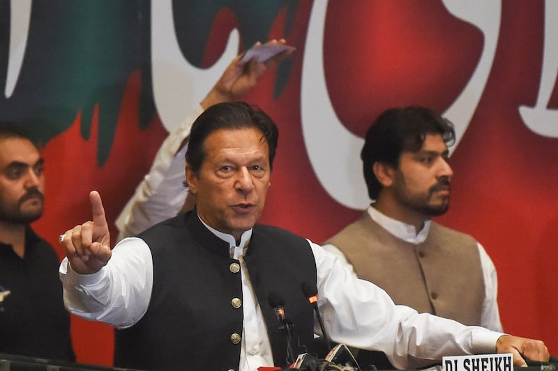Former Pakistan prime minister Imran Khan addresses Pakistan Tehreek-e-Insaf party workers at a party meeting in Lahore on April 27. AFP