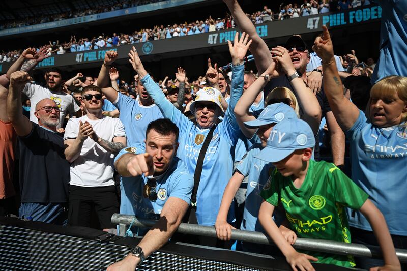 Manchester City fans celebrate after Phil Foden'sopener. Getty Images