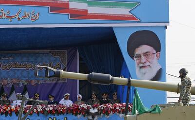 An Iranian army tank rolls past the tribune decorated with a portrait of Iran's Supreme Leader Ayatollah Ali Khamenei during a parade on the occasion of the country's annual army day on April 18, 2018 in Tehran.
President Hassan Rouhani said during the parade that Iran "does not intend any aggression" against its neighbours but will continue to produce all the weapons it needs for its defence. / AFP PHOTO / ATTA KENARE