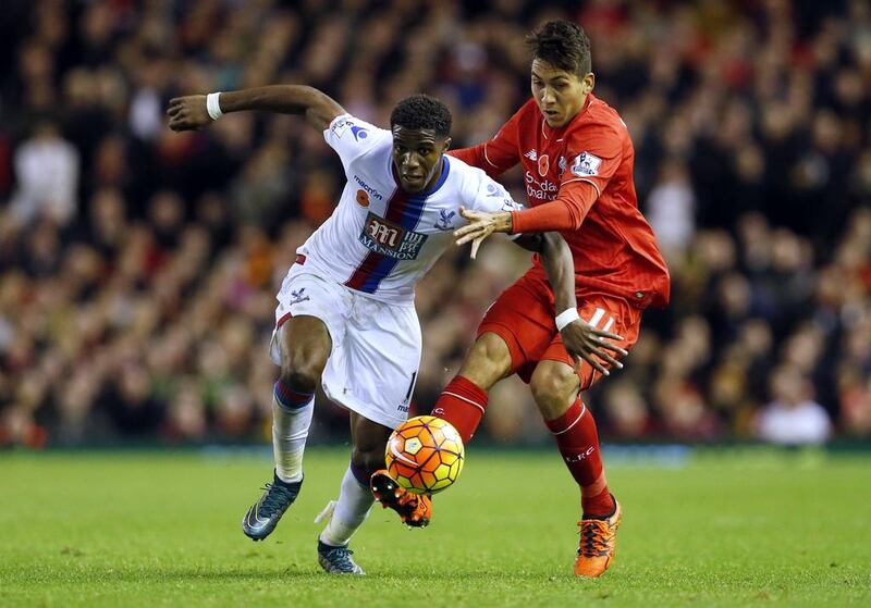 Wilfried Zaha, left, was one of four wingers in Crystal Palace's starting line-up at Anfield. Lee Smith / Reuters

