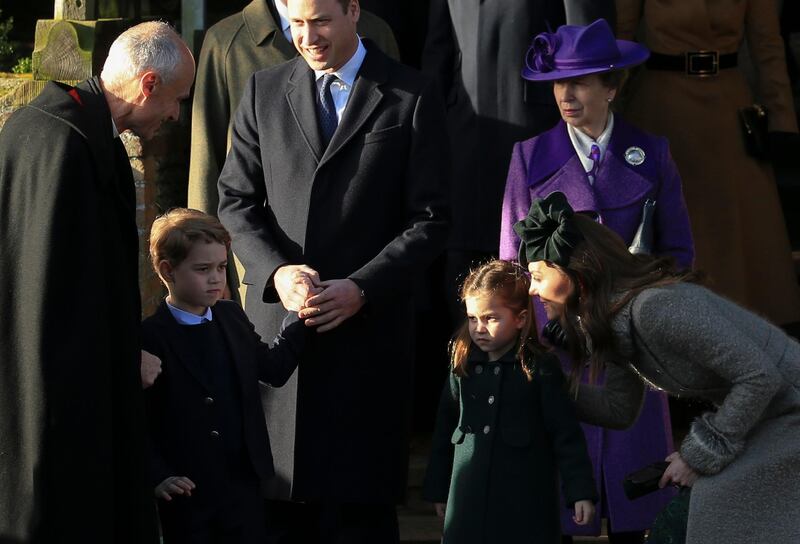 Britain's Prince William, Duke of Cambridge and Catherine, Duchess of Cambridge stand with their children Prince George and Princess Charlotte after attending a Christmas day service at the St Mary Magdalene Church. AP