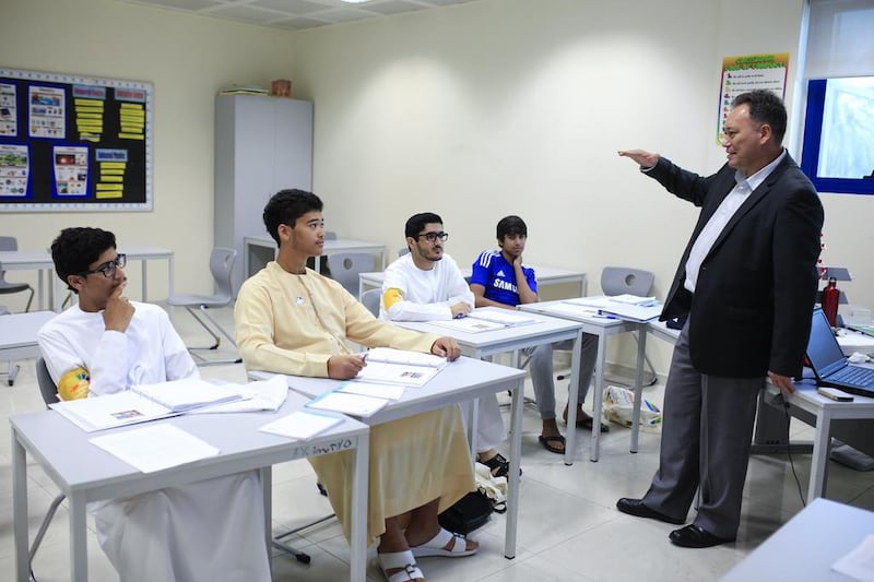 Robert Anderson, a curriculum specialist in business, teaches a customer service and merchandising class as part of the Yes to Work programme at the Institute of Applied Technology in Dubai. Sarah Dea / The National