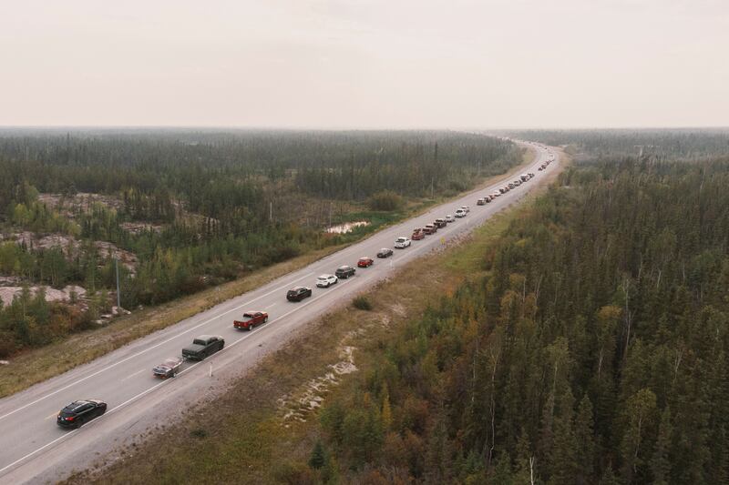 Residents leave Yellowknife following an evacuation order, as a wildfire approached the city in Northwest Territories, Canada. Reuters