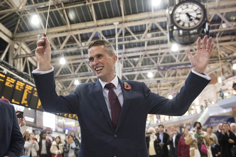 As Secretary of State for Defence, Gavin Williamson conducting the Band of the Grenadier Guards at Waterloo Station in London, in November 2017. PA