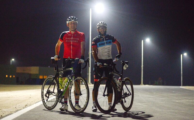 Abu Dhabi, United Arab Emirates - From left, Peter Manson, and Sherif Said members of the Al Raha Cycling group, train during the month of Ramadan at Al Hudayriyat Island on June 4, 2018. (Khushnum Bhandari/ The National)