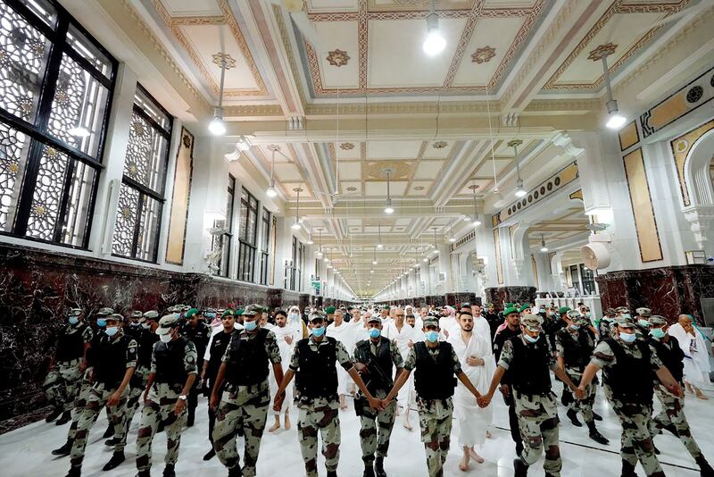 Mustafa Al Kadhimi, surrounded by security forces at the Grand Mosque complex in Makkah. AFP