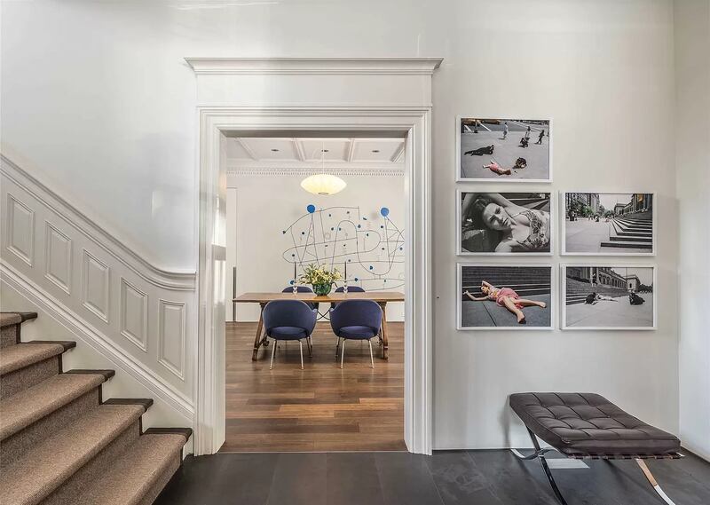 The interior provides a juxtaposition between old and new, combining restored historic elements with contemporary millwork and detailing. Photo: Zillow