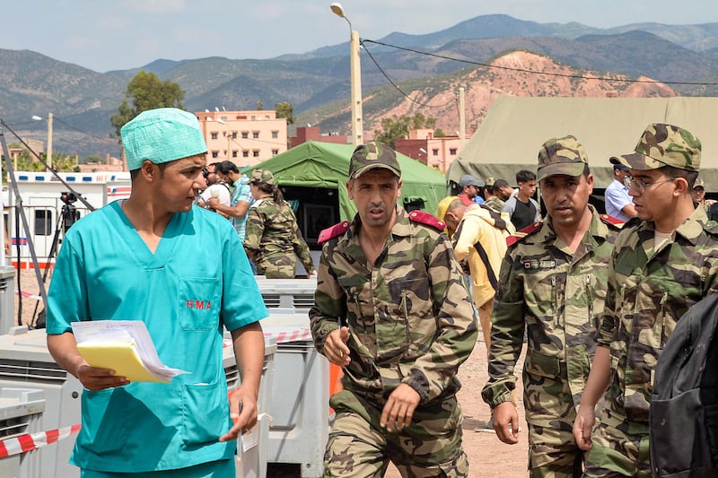 A surgeon and armed forces medics at the military field hospital for earthquake survivors in the village of Asni in Morocco's Al Haouz province. AFP