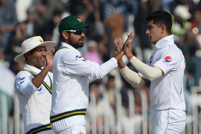 Pakistan bowler Naseem Shah, right, picked up a hat-trick against Bangladesh during the third day of the first Test at the Rawalpindi Cricket Stadium. AFP