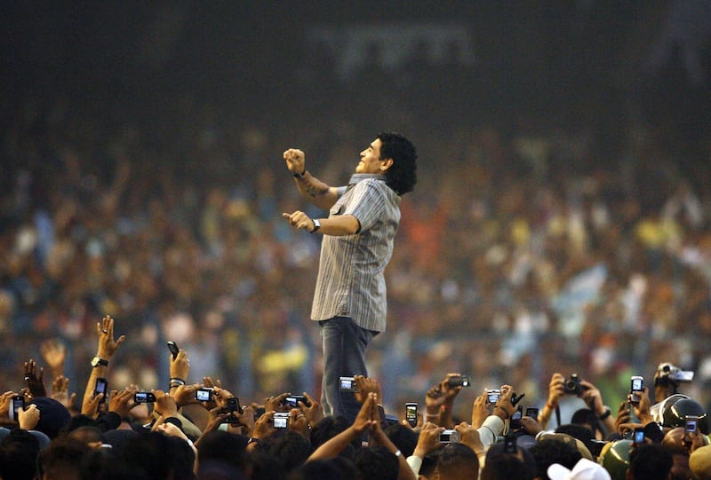 In this file picture taken on December 6, 2008 Argentina's national team coach and former football star Diego Armando Maradona gestures as he attends a felicitation programme at Salt Lake Stadium in Kolkata, India. AFP