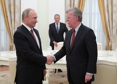 John Bolton with Russian President Vladimir Putin at the Kremlin in June 2018 while he was US national security adviser. EPA

