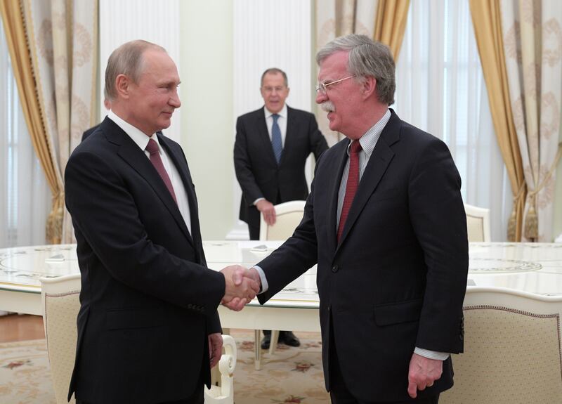 Russian President Vladimir Putin and Mr Bolton during their meeting at the Kremlin in 2018. EPA