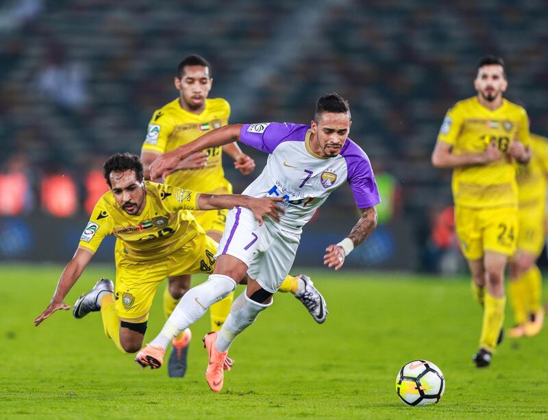 Abu Dhabi, UAE.  May 3, 2018.   President's Cup Final, Al Ain FC VS. Al .
(L-R) Salem Al Azizigrabs the shirt of Anthony Caceres during the match.
Wasl.  Victor Besa / The National
Sports
Reporter: John McAuley