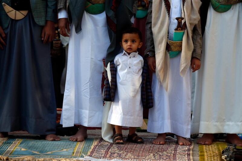 A Yemeni child joins worshippers in Sanaa, Yemen for Eid prayers. EPA