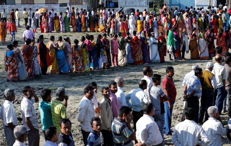 Voters line up to cast their votes outside a polling station in Alipurduar. Reuters