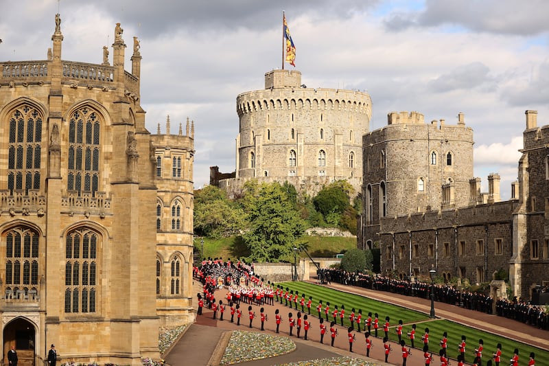 The procession, led by the dismounted detachment of the Household Cavalry, followed by massed Pipes and Drums of Scottish and Irish regiments, the Brigade of Gurkhas, the Royal Air Force and the Band of the Grenadier Guards, arrives at Windsor Castle. Getty Images
