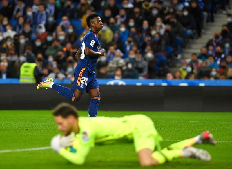 Real Madrid's Brazilian forward Vinicius Junior runs past Real Sociedad's Spanish goalkeeper Alex Remiro. AFP