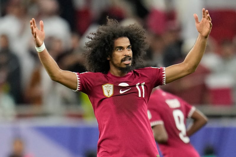 Akram Afif celebrates after putting Qatar 2-1 ahead against Iran. AP