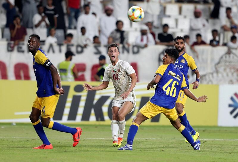 Abu Dhabi, United Arab Emirates - August 12, 2019: Leonardo of Al Wahda delivers the ball during the Asian Champions League round 16 return leg between Al Wahda of the UAE and Al Nassr of Saudi Arabia. Monday the 12th of August 2019. Al Wadha, Abu Dhabi. Chris Whiteoak / The National