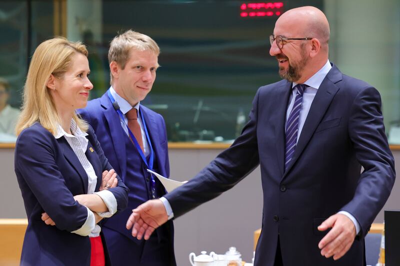 European Council President Charles Michel, right, and Estonian Prime Minister Kaja Kallas, left, talk before the second day's session of an extraordinary meeting of EU leaders to discuss Ukraine, energy and food security, in Brussels. AP