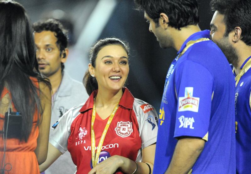 Kings XI Punjab co-owner and Bollywood actress Preity Zinta gestures during the IPL Twenty20 cricket match between Kings XI Punjab and Rajasthan Royals at the Punjab Cricket Association (PCA) stadium in Mohali on May 5, 2012. RESTRICTED TO EDITORIAL USE. MOBILE USE WITHIN NEWS PACKAGE. AFP PHOTO/RAVEENDRAN (Photo by RAVEENDRAN / AFP)