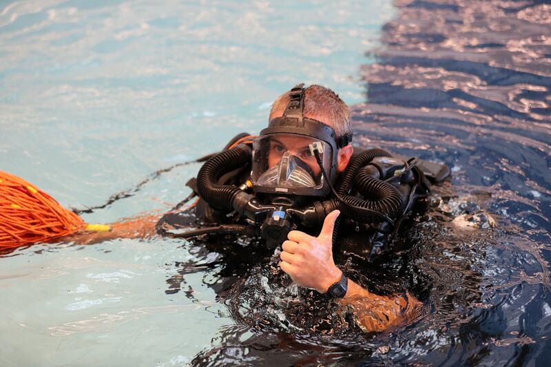 Royal Navy ship divers try out the new Deep Dive Dubai pool.