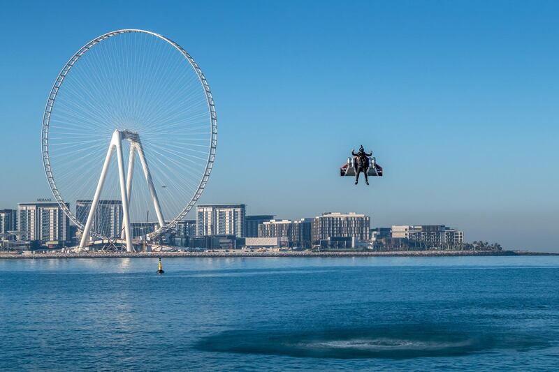 Vince Reffet, known as Jetman, takes part in a flight near the Ain Dubai (Dubai Eye) Ferris Wheel in February 2020. AFP / Expo 2020
