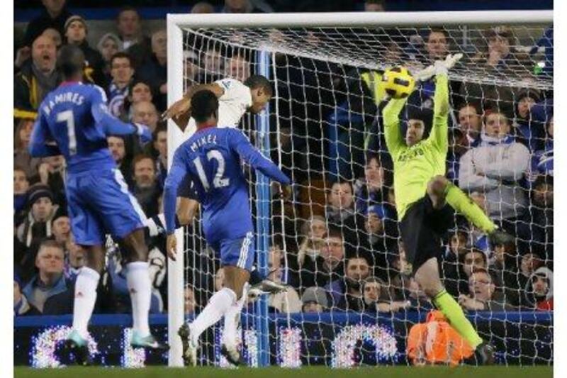 Jermaine Beckford heads past Petr Cech in the Chelsea goal to earn Everton a point.   Kirsty Wigglesworth / AP Photo