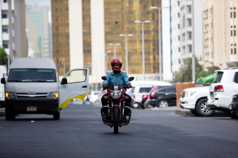Abu Dhabi, United Arab Emirates, July 18, 2016:    Mohammed  Aminuddin  an expatriate motorcycle delivery driver for the Hyderabad Star restaurant in the Al Danah area of Abu Dhabi on July 18, 2016. Christopher Pike / The National

Job ID: 59156
Reporter: Anwar HajiKaram
Section: News
Keywords:  *** Local Caption ***  CP0718-na-POAN06.JPG