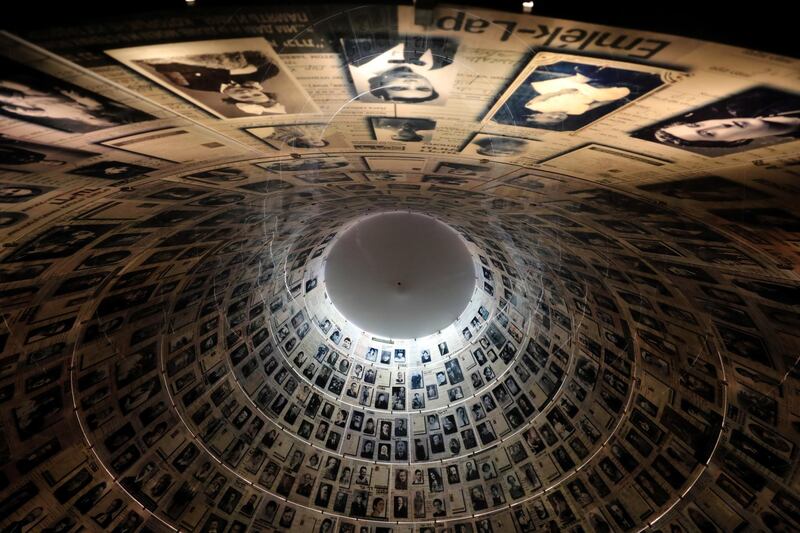 FILE PHOTO: A view from below shows pictures of Jews killed in the Holocaust displayed at the Hall of Names in the Holocaust History Museum at the Yad Vashem World Holocaust Remembrance Center in Jerusalem January 15, 2020. REUTERS/Ammar Awad/File Photo