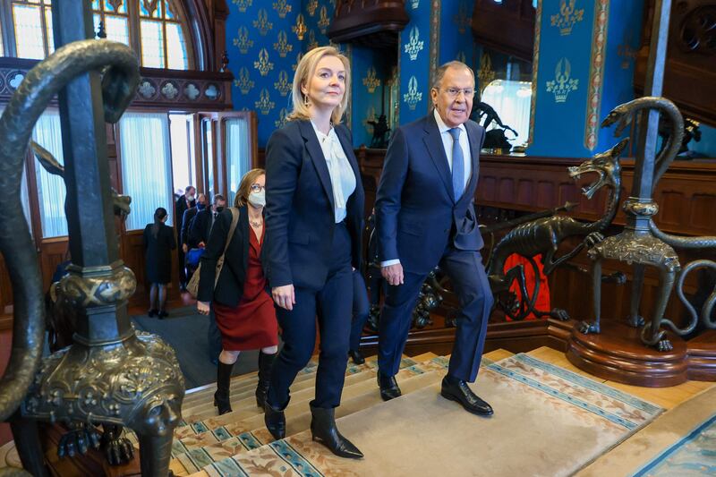 Sergey Lavrov, Russian Foreign Minister, and Liz Truss make their way to their meeting in Moscow. AFP