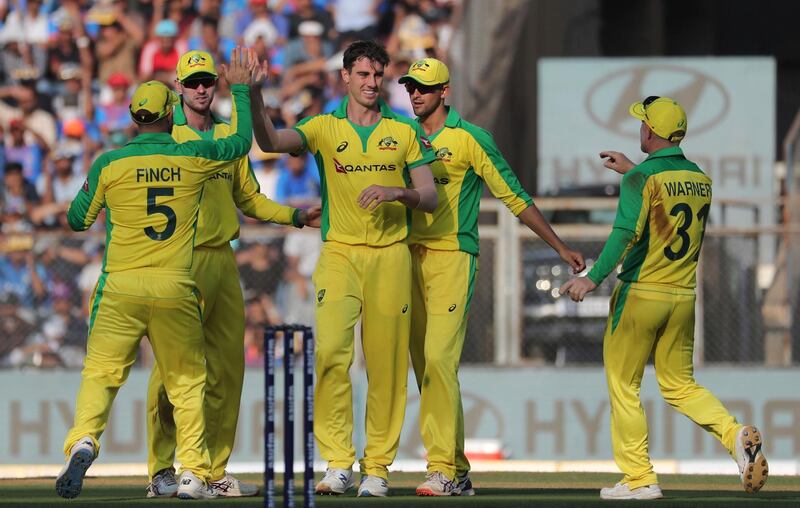 Australia quick Pat Cummins, third from left, celebrates the dismissal of India's Rishabh Pant. AP