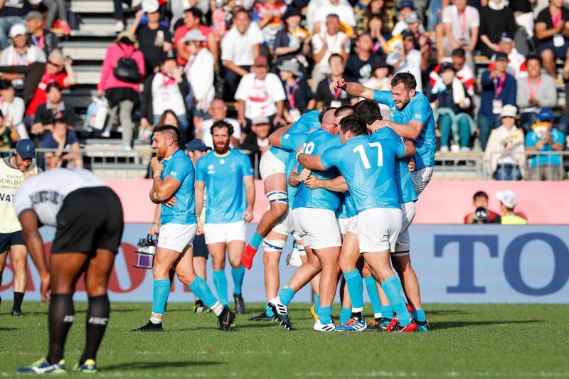 epaselect epa07867673 Uruguay players celebrate after winning against Fiji during the Rugby World Cup match between Fiji and Uruguay in Kamaishi, Japan, 25 September 2019.  EPA-EFE/MARK R. CRISTINO EDITORIAL USE ONLY/ NO COMMERCIAL SALES / NOT USED IN ASSOCATION WITH ANY COMMERCIAL ENTITY *** Local Caption *** 55494304