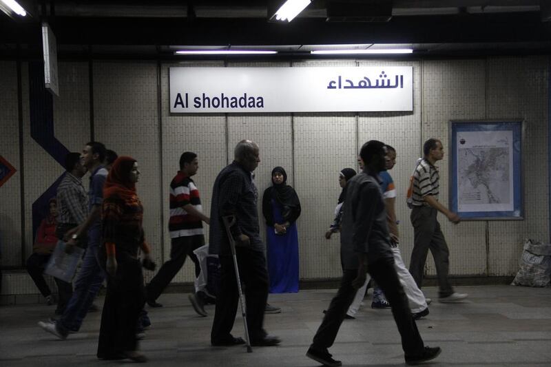 Egyptians make their way through Al Shohadaa (Martrys) metro station.