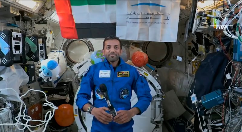 This photo provided by NASA shows Emerati astronaut Sultan al-Neyadi during an interview at the International Space Station on Tuesday, March 7, 2023.  The first Arab astronaut assigned to a long spaceflight is still adjusting to life off the planet, five days after rocketing to the International Space Station.  (NASA via AP)