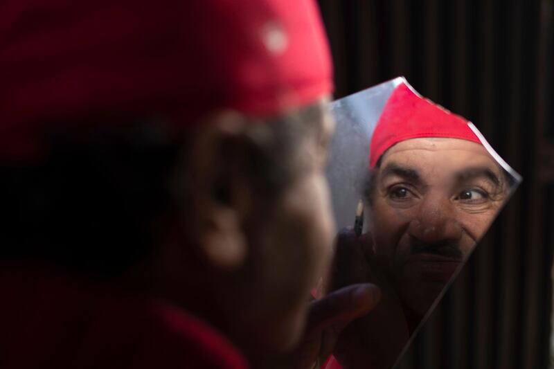 Belhussein Abdelsalam, applies make-up to transform himself into silent movie legend Charlie Chaplin's Little Tramp character. He hit upon the idea after seeing Chaplin on television. AP Photo