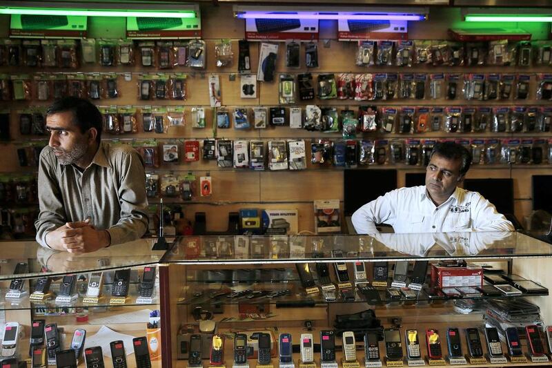 Business has slowed for the owners of a mobile phone shop in Marikana in South Africa with the drawn-out strike of mineworkers. Siphiwe Sibeko / Reuters