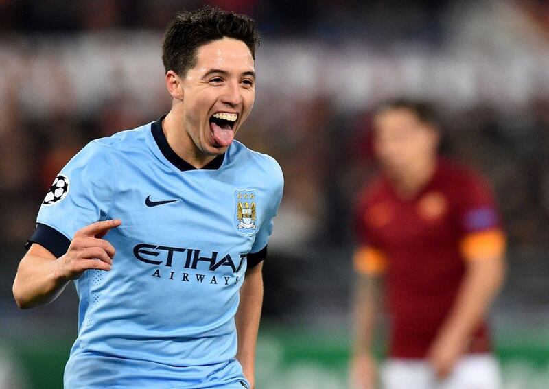 Manchester City's Samir Nasri celebrates after setting up Pablo Zabaleta's goal, Manchester City's second, in their 2-0 win over AS Roma on Wednesday night to advance to the Champions League knockout rounds. Gabriel Bouys / AFP / December 10, 2014 