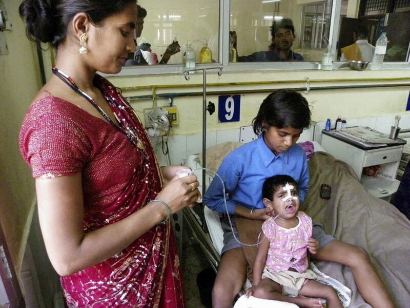 A child undergoes treatment for encephalitis in Uttar Pradesh state. A reader says the Indian government may not be able to tackle the disease effectively unless it addresses the issue of hygiene and sanitation. Biswajeet Banerjee / AP Photo