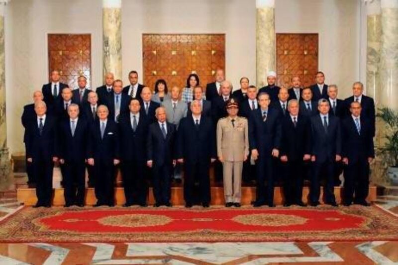 The interim Egyptian government members stand to attention for a group picture.
