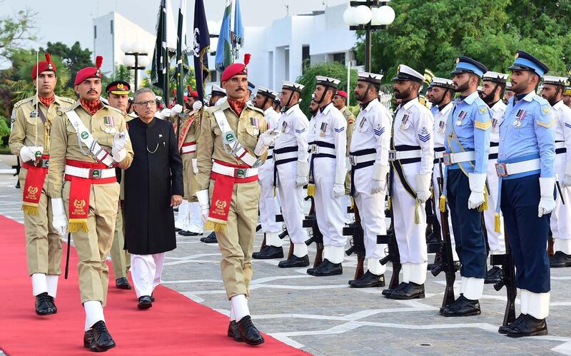 In this handout photograph released by the Press Information Department (PID) on September 9, 2018, Pakistan newly President Arif Alvi inspects guard of honour after taking oath at the Aiwan-e-Sadr in Islamabad. - Pakistan's new President Arif Alvi was sworn in at a ceremony in Islamabad on September 9, concluding the country's peaceful transfer of power to its new government after a turbulent election campaign. (Photo by Handout / PID / AFP) / -- RESTRICTED TO EDITORIAL USE - MANDATORY CREDIT "AFP PHOTO / PID " - NO MARKETING NO ADVERTISING CAMPAIGNS - DISTRIBUTED AS A SERVICE TO CLIENTS ---