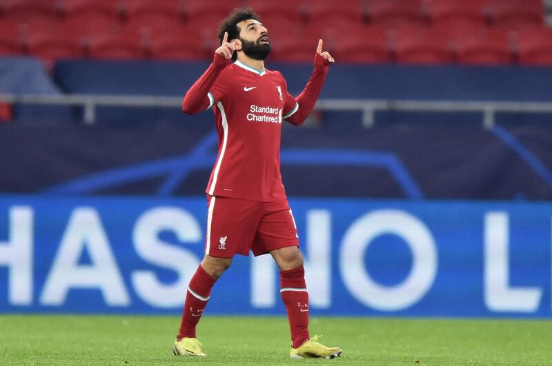 Liverpool's Egyptian midfielder Mohamed Salah celebrates scoring his team's first goal during the UEFA Champions league Last 16 2nd Leg football match between Liverpool and RB Leipzig at Puskas Arena in Budapest, Hungary, on March 10, 2021. / AFP / Attila KISBENEDEK
